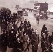 Commuters on their way to work near London Bridge, London, circa 1940s