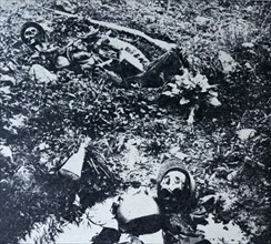 The remains of two French soldiers lie in a shell crater at Verdum during World War I