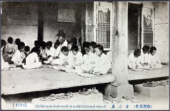 Children study at a traditional Korean school with their teacher