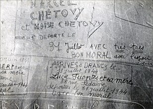 Messages of courage inscribed by Parisians on a wall before they were taken prisoner to Drancy internment camp by Germans during World War II