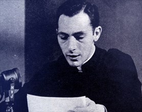 Priest broadcasting a religious message to millions on a Marconi short-wave radio from the Vatican City