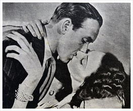 Barry K. Barnes and Judy Kelly kissing in a scene from The Midas Touch