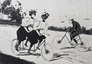 French illustration of two female tandem cyclists passing a male cyclist