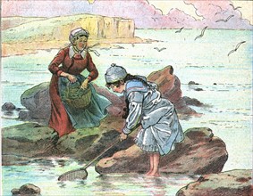 Little girl fishing at the seaside