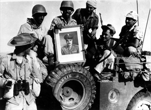 Suez Crisis, Israeli soldiers bringing back a portrait of Nasser as a souvenir