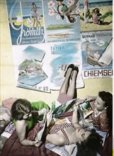 Germany, Young women looking at travel brochures