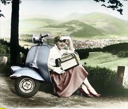 young woman with a Vespa