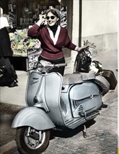 Woman next to a motor scooter by Dürkopp