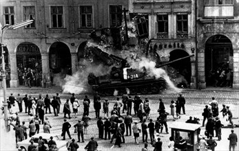 Prague Spring: Soviet tank crashing against a building in Prague