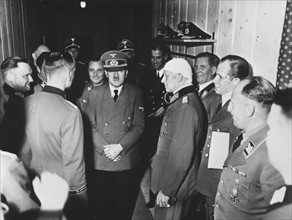 Adolf Hitler surrounded by his staff at his headquarters 'Wolfsschanze'