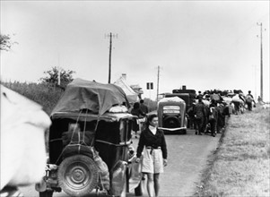 Refugees on a road in the Calais region