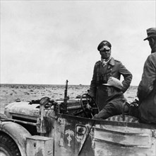 Rommel, Erwin 1891-1944
Officer, general field marshall, germany
commander of the german africa corps Feb.41-March 43 (WWII) - General of the Panzertruppe Rommel in his command post vehicle with the...