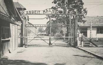 Entrance of the concentration camp Auschwitz with the sign: Arbeit macht frei'. Around 1943