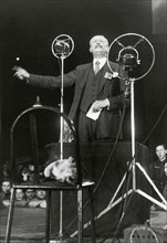 French politician Léon Blum is delivering a speech at a political meeting. Photography. 1937.