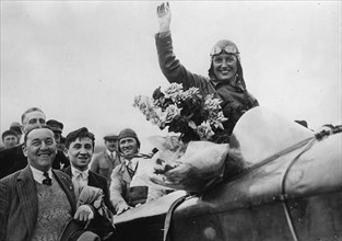 The aviatrix Maryse Bastié is received after her flight from Paris to Nizhni-Novgorod in Paris. 12th February 1937. Photograph.