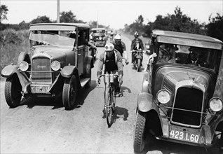 Cycling Tour de France: A cyclist with escort cars - 1930 - Vintage property of ullstein bild