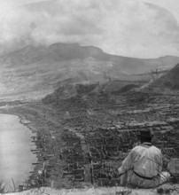 French overseas department Martinique, view from Orange Hill over dead Saint-Pierre, to steaming Mount Pelee after strongest volcanic eruption of Mount Pelee, 8 May 1902