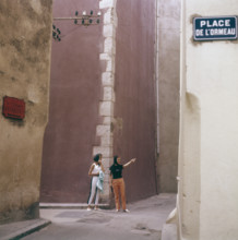 In the 1960s. Two female tourists in a street corner in the town Saint-Tropez on the French riviera. T...