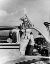 Marilyn Monroe, actress USA, waving out of an aeroplane. Around 1953