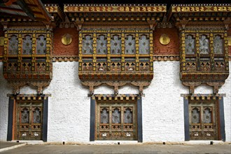 Gorgeous ornate windows and bay window in the Punakha Dzong monastery fortress