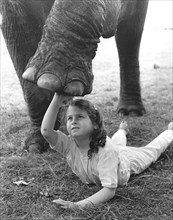 Girl with elephant leg