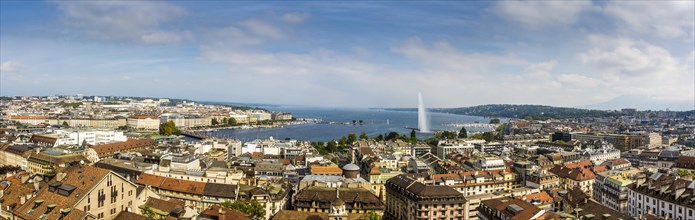 Cityscape with Lake Geneva Lake and the fountain Jet d'eau taken from a tower of the Cathedrale Saint Pierre