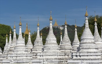 Row of white stupas at Sandamuni Pagoda