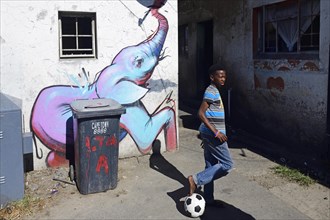 Children play football in Khayelitsha Township