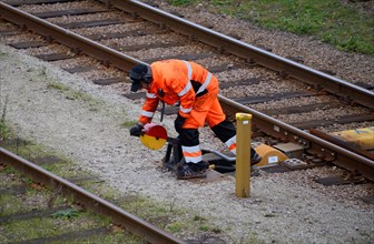 Railway worker shunt a switch on railway station