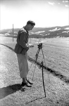 Man is photographing the landscape around 1950 in Freiburg