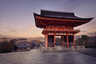Nio-mon gate of Kiyomizu-dera Buddhist temple in beautiful sunrise morning scenery with dramatic red sky