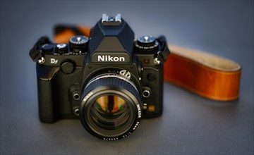 DSLR Nikon Df with Nikkor AI-S 50mm 1.2 in retro style