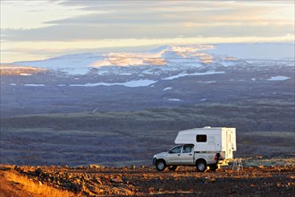Camper Van parked in volcanic landscape