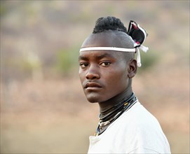 Young Himba man with traditional hairstyle
