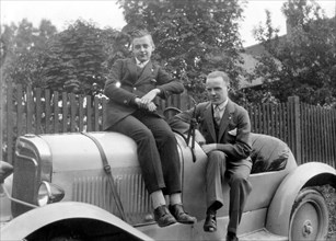 Two young men are proud of their car about 1929