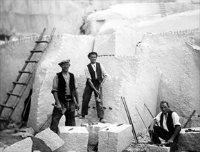 Three men working in the quarry