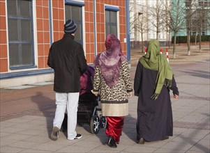 Muslim family with pram