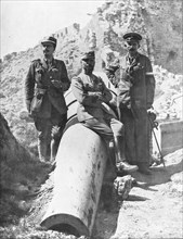 French general Gouraud sitting on a destroyed Turk canon