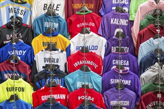 Football jerseys with names of football players for sale at sales stall