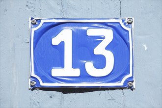 Plate with house number thirteen