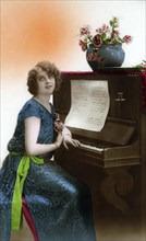 Woman Sitting Longingly at the Piano