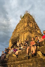 Tourists watch sunset at Pre Rup Temple
