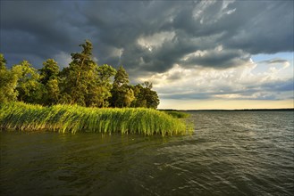 Thunderstorm clouds over Lake Scharmutzelsee