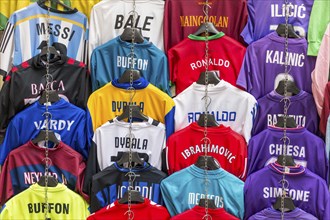 Football jerseys with names of football players for sale at sales stall
