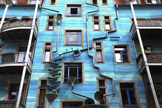 Blue house facade with rain pipes