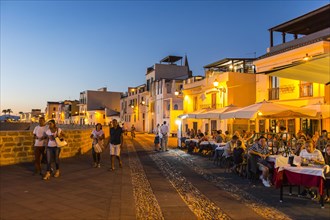 Waterfront in the coastal town of Alghero after sunset