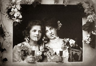 Two women drink and smoke