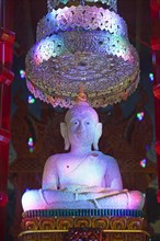 Buddha statue decorated with pearls in the temple Wat Khao Rang