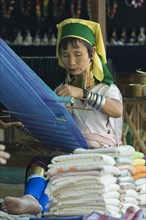 Padaung or long neck woman weaving