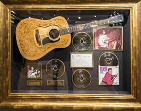 Guitar and records from Elvis Presley in a showcase